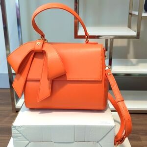 NWOT GUNAS New York Orange Cottontail Handbag with Bow Accent